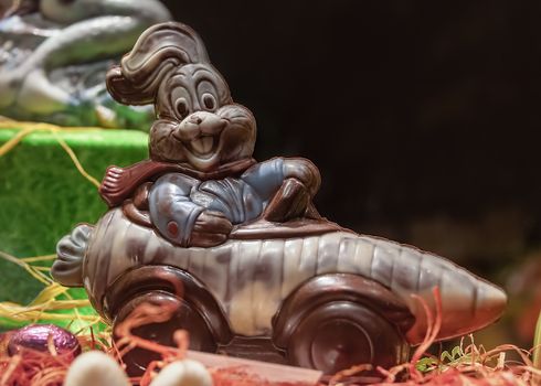 France, Strasbourg - May 2018: Chocolate Easter bunny - driving a carrot shaped car