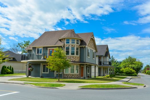 Luxury family house on cloudy, blue sky background in British Columbia, Canada