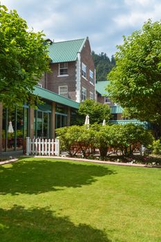 Small lawn in front of a building entrance