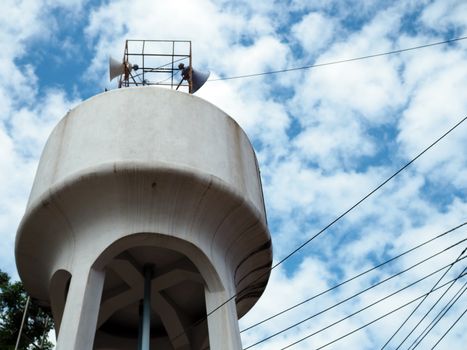 White water tank On the background is an empty blue sky.
Minimal concept.