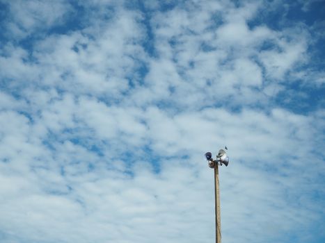 The broadcasting tower is made of cement pillar on the background, is a bright blue sky and empty.
Minimal concept.