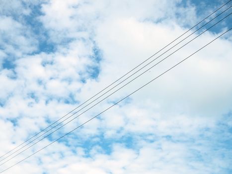 The high voltage cable on the background is an empty blue sky.
Minimal concept.