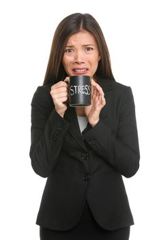 Stress. Business woman stressed being too busy. Businesswoman in suit holding head drinking coffee creating more stress. Mixed race Asian Caucasian female isolated on white background.