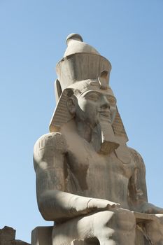 Large ancient statue of Ramses II at Luxor temple in Egypt