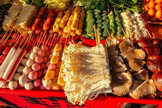 Exotic snacks and desserts can be found in this famous market Donghuamen Night food market near Wangfujing street, Beijing, China
