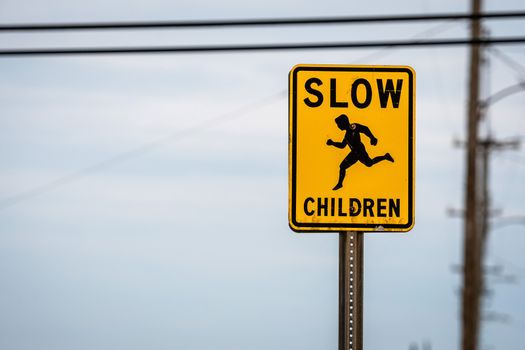 slow children caution sign on a street