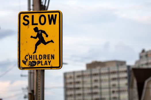 slow children caution sign on a street