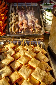 Exotic snacks and desserts can be found in this famous market Donghuamen Night food market near Wangfujing street, Beijing, China