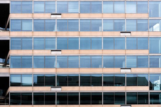 Glass office building facade with windows, texture, architecture