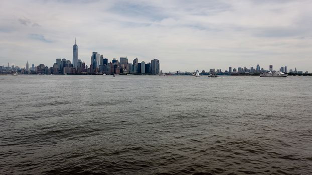 Skyline and modern office buildings of Midtown Manhattan viewed from across the Hudson River. - Image