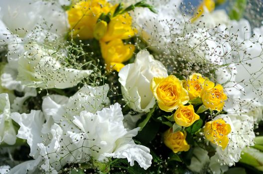 White and yellow flowers in the wedding floral decorations.