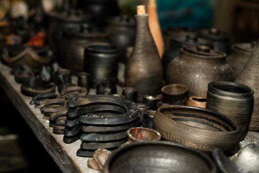  Burnt black ceramics. Burnt clay pots and plates, dishes - Image