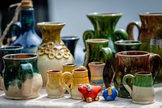 Colorful clay vases and pots on marketplace in Rga. Selective focus - Image