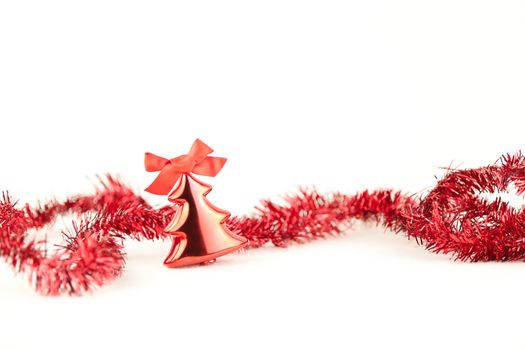 Isolated red Christmas tree bauble with red wreath and red flake on white background