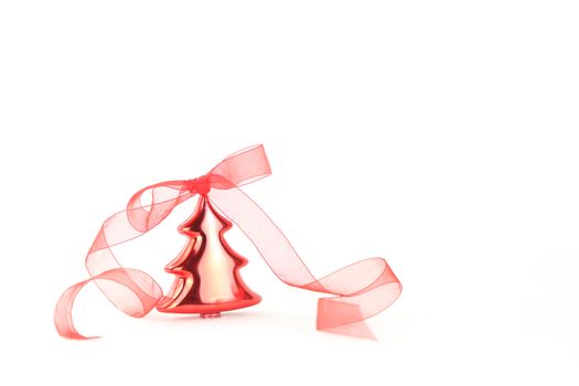 Isolated red Christmas tree bauble with red organza ribbon on white background