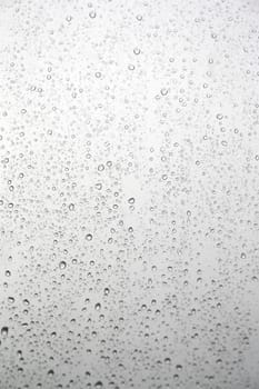 Drops of rain on the inclined window (glass). Shallow DOF