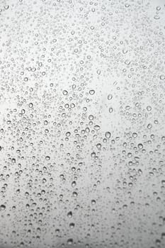 Drops of rain on the inclined window (glass). Shallow DOF