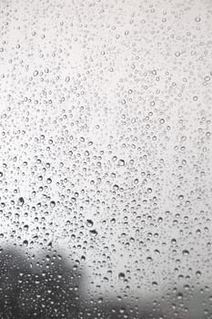 Drops of rain on the inclined window (glass). Shallow DOF