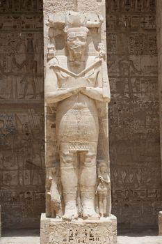 Statue of a pharaoh at the temple of Medinat Habu in Luxor