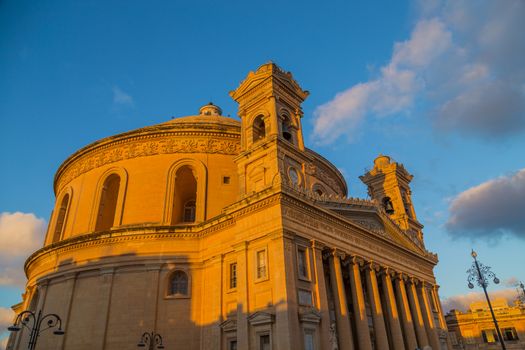 Mosta Dome Cathedral (St. Mary church) The Parish Church of Assumption under the blue sky , rotunda square. Malta