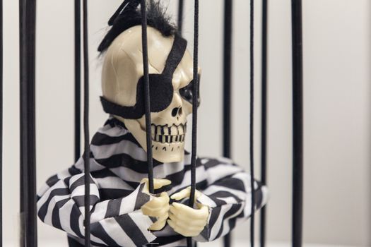 Skeleton toy in a prison