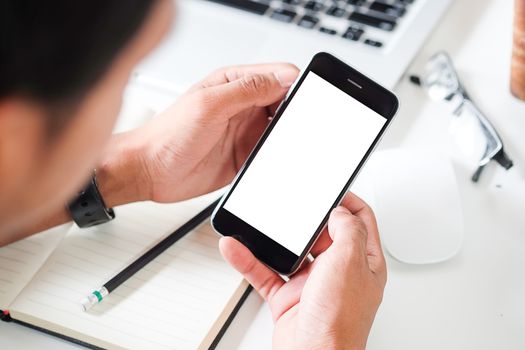 Cropped shot view of man hands holding smart phone with blank copy space screen for your text message or information content, female reading text message on cell telephone during in urban setting. 