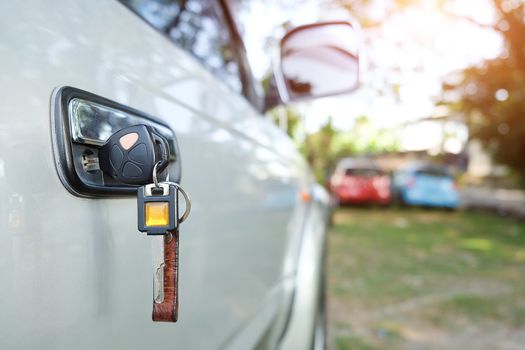 Close up of car key in the key hole for the ignition. Starting macro modern car key.