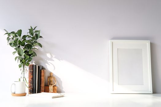 Mockup workspace desk and copy space books,plant and coffee on white desk.
