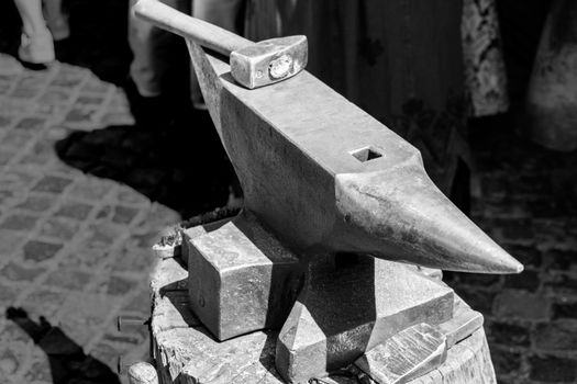 Hammer and anvil from a medieval forge in black and white, Germany