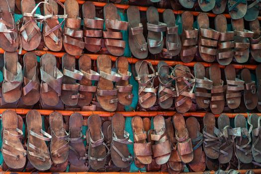 Full Frame Shot Of Multi Colored Sandals Hanging On Wall In Market Stall
