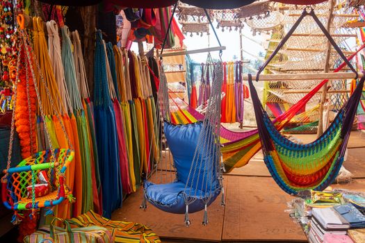 Close-up of multi-colored hammocks, open air market in India