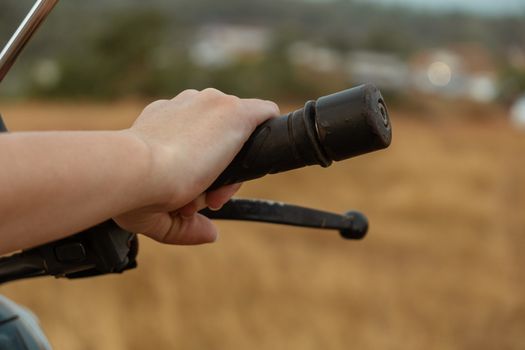 Cropped Woman Hand Riding Motorcycle