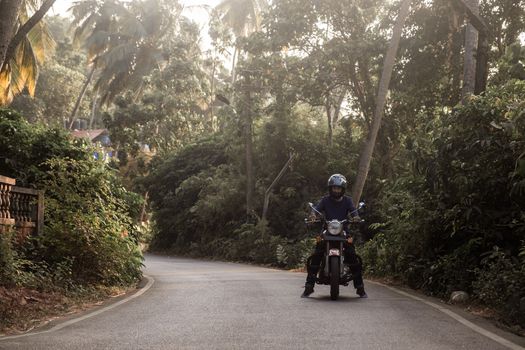 A Man On Motorcycle On Road in GOA village