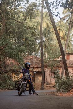 A Man On Motorcycle On Road in GOA village