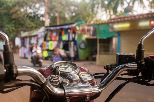 Driving a motorcycle overlooking the Indian bazaar