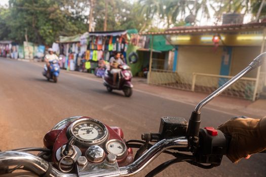 Driving a motorcycle overlooking the Indian bazaar