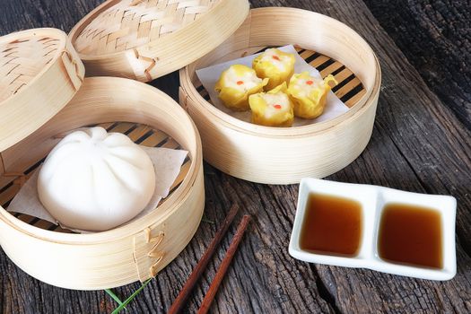 Dim sum Chinese food is placed on the table.