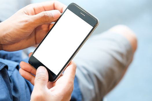 Cropped shot view of man hands holding smart phone with blank copy space screen for your text message or information content, female reading text message on cell telephone during in urban setting. 