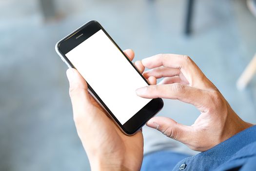 Cropped shot view of man hands holding smart phone with blank copy space screen for your text message or information content, female reading text message on cell telephone during in urban setting. 