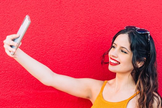 Portrait Of A Happy Young Woman Taking Selfie.