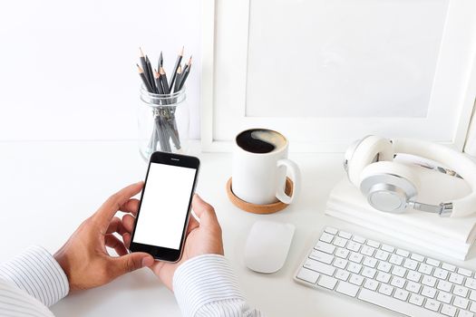 Cropped shot view of man hands holding smart phone with blank copy space screen for your text message or information content, female reading text message on cell telephone during in urban setting. 
