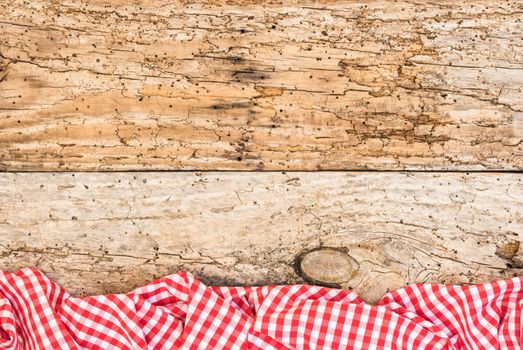 Vintage wooden table background rustic texture, with red checkered tablecloth, high angel view