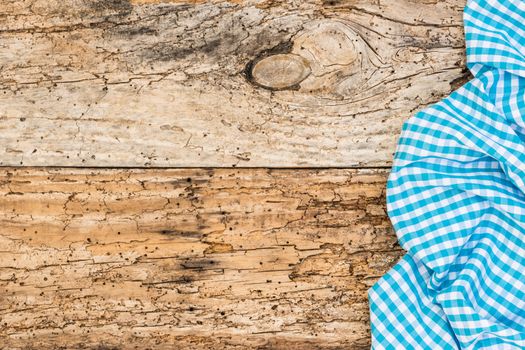 Wooden table background rustic texture, with blue checkered tablecloth, high angel view