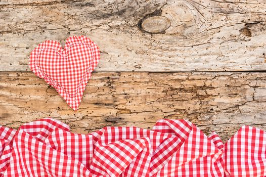 Romantic red heart on rustic old wooden background for Valentine card with copy space