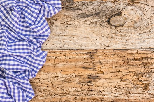 Wooden table background rustic texture, with blue checkered tablecloth, high angel view