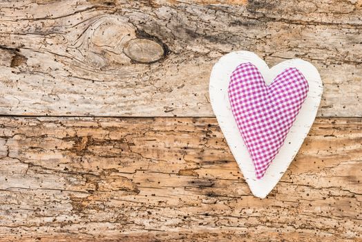 Romantic heart on rustic wooden background with copy space
