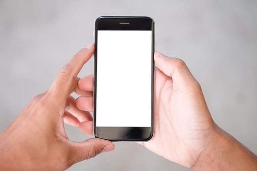 Cropped shot view of man hands holding smart phone with blank copy space screen for your text message or information content, female reading text message on cell telephone during in urban setting. 