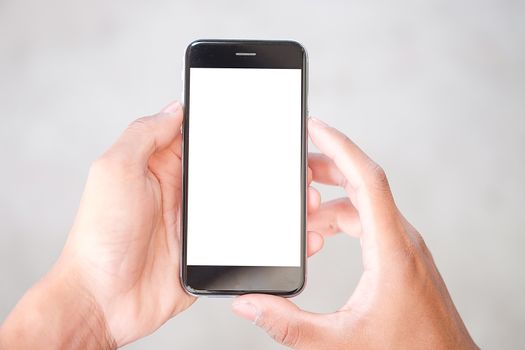 Cropped shot view of man hands holding smart phone with blank copy space screen for your text message or information content, female reading text message on cell telephone during in urban setting. 