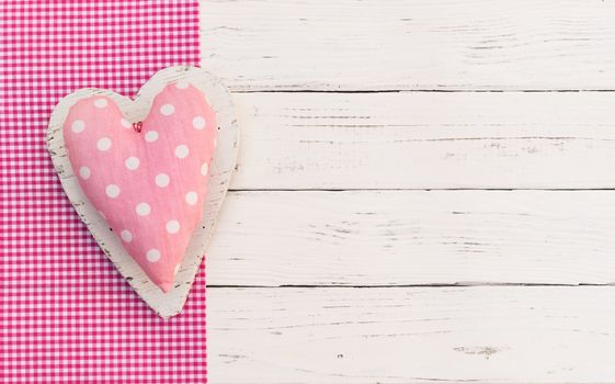Baby girl birthday greeting card background with pink heart and copy space