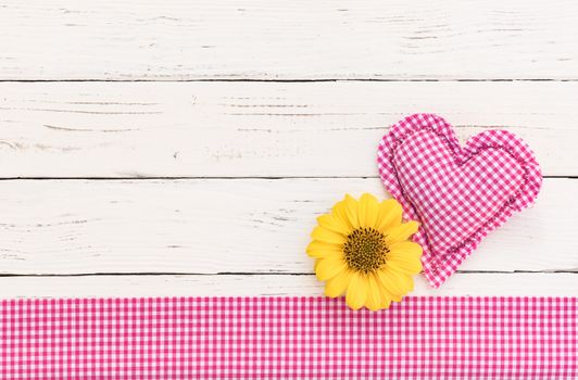 Baby girl birthday greeting card background with pink heart, blossom and copy space